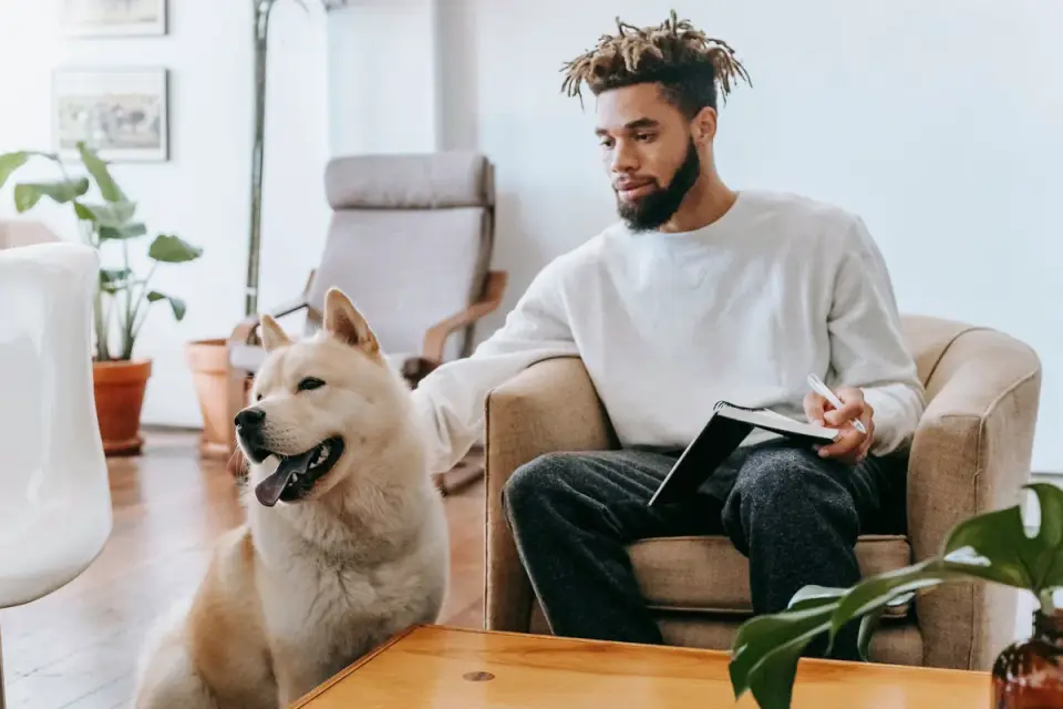 Dog in a kitchen with an owner