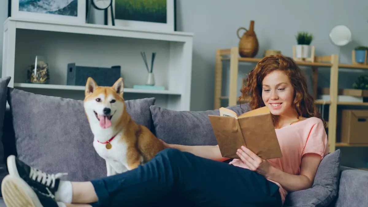 Dog owner at home