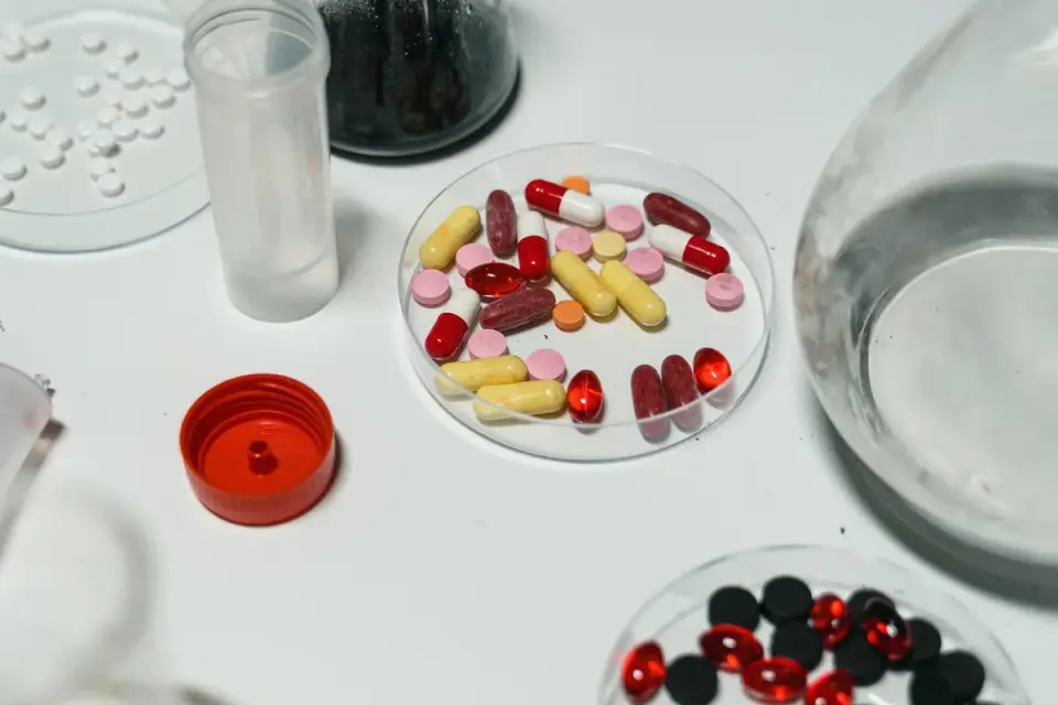 Several dog supplement bottles next to a printed certificate of analysis document